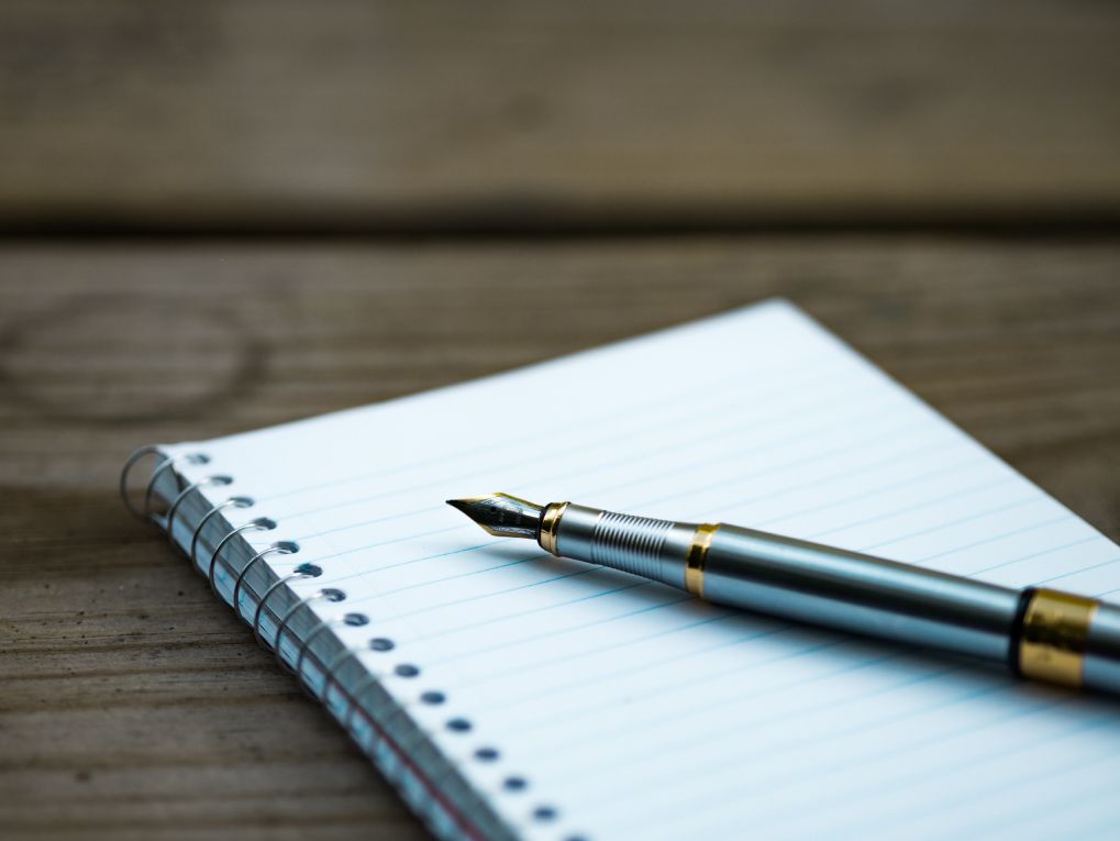Notebook with a pen